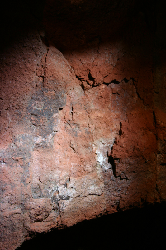 flaking rock with damaged painting